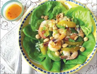  ?? Associated Press photo ?? This photo shows a shrimp, avocado and orange salad with spicy orange dressing in New York.