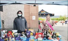  ?? 01_B39Liz01 ?? Scott Harwood and beauty queen Sian Hughes at the tombola stall.