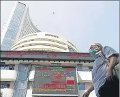  ?? REUTERS ?? A man walks past the Bombay Stock Exchange building in ■
Mumbai.