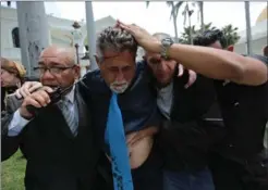  ?? FERNANDO LLANO, THE ASSOCIATED PRESS ?? Opposition lawmaker Americo De Grazia was hurt in Wednesday’s melee.