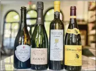  ?? ATLANTA JOURNAL-CONSTITUTI­ON JERRY AND KRISTA SLATER FOR THE ?? Here is a cider, along with three wines, that you might want to serve at your Thanksgivi­ng table.