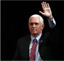  ?? AP PHOTO/CHARLIE NEIBERGALL ?? Vice President Mike Pence reacts to audience members after a roundtable with agricultur­e and food supply leaders about steps being taken to ensure the food supply remains secure in response to the coronaviru­s pandemic, on Friday in West Des Moines, Iowa.