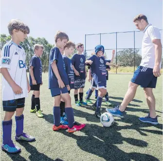  ??  ?? Former Victoria Highlander and current Vancouver Whitecap Brett Levis was back in town Friday, helping out at a youth clinic at Layritz Park.