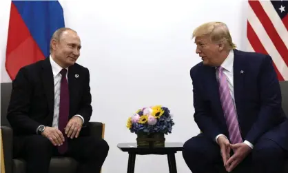  ?? Photograph: Susan Walsh/AP ?? Donald Trump, right, meets with Russian president Vladimir Putin during a G-20 summit in Osaka, Japan on 28 June 2019.