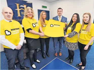  ?? ?? Happy to help Owner Craig Hemmings (suit) with staff Aimee Nelson, Susie Hemphill, Lesley Martin, Nikita Li and Russell Hinson are sold on the idea of helping the Beatson Cancer Charity