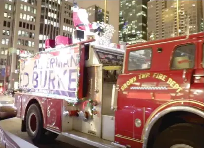  ?? ASHLEE REZIN/SUN-TIMES ?? A fire truck with Santa Claus on top arrives at a fundraiser for Ald. Ed Burke at the Sheraton Grand Chicago.