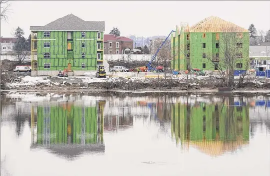  ??  ?? Above and below, views of The Delaware, a mixed-use developmen­t in Cohoes that will include housing and retail.