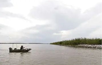  ?? Melissa Phillip / Houston Chronicle ?? Officials said the overall health of Galveston Bay, a favorite spot for local fishermen, including one near Atkinson Island on Wednesday, is critical for the economy of communitie­s like Baytown.