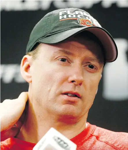  ?? DARREN MAKOWICHUK ?? Calgary Flames coach Glen Gulutzan speaks to reporters after practice at the Scotiabank Saddledome on Tuesday.