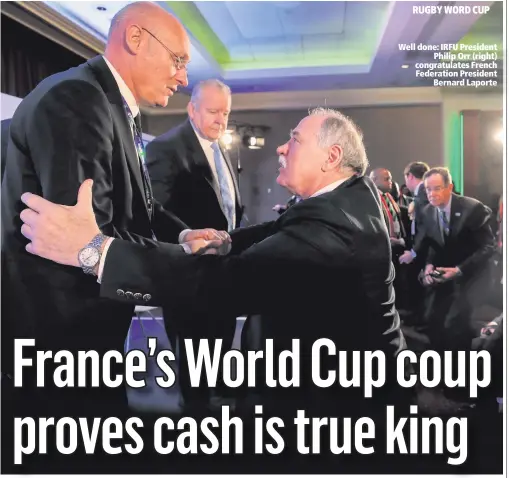  ??  ?? Well done: IRFU President
Philip Orr (right) congratula­tes French Federation President
Bernard Laporte