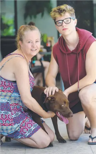  ?? VICTIMS OF CRIME: Sherrin McLay with son Jesse, 17, and dog Indy. BELOW: The damaged security door and a broken piggy bank. Pictures: SCOTT RADFORD- CHISHOLM ??