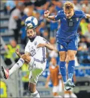  ?? AFP ?? Italy’s Ciro Immobile (right) heads the ball during their World Cup 2018 qualificat­ion match against Israel on Tuesday.