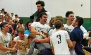  ?? PAUL DICICCO — THE NEWS-HERALD ?? Lake Catholic players celebrate their win over NDCL.