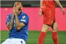  ?? Pizzoli/AFP/Getty Images ?? João Pedro expresses the pain of a nation but his appearance from the bench symbolised Italy’s desperatio­n. Photograph: Alberto