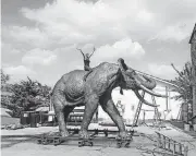  ?? [PHOTO PROVIDED BY MARK PALMERTON] ?? Jocelyn Russell, sculptor, sits atop one of the five elephants she created for the Audubon Zoo in New Orleans. The elephants were cast at the Crucible Foundry in Norman.