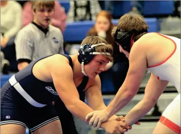  ??  ?? Gordon Lee’s Caleb Vines looks to lock up with his opponent during a 220-pound bout against Mt. Zion during the Area 3-A Duals at Trion last Tuesday. The Trojans lost a close 42-36 match and eventually finished third in the tournament, but missed on a trip to the State Duals. (Catoosa News photo/Scott Herpst)