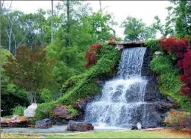  ?? PHOTOS BY LINDA GARNER-BUNCH/Arkansas Democrat-Gazette ?? A rushing waterfall marks the entrance to the Hurricane Lake Estates subdivisio­n. To attend today’s tour of homes in Hurricane Lake Estates, take exit 123 from Interstate 30 at Bryant. Follow Reynolds Road to Arkansas 5 and turn left and go about 1.6...