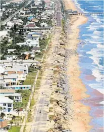  ?? RED HUBER/STAFF FILE PHOTO ?? Hurricane Matthew took out “shark-bite” chunks of State Road A1A in Flagler Beach when it passed off Florida’s east coast last October. The road is now on tap now for a permanent reconstruc­tion.