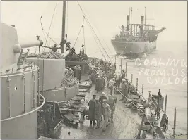  ?? U.S. NAVAL HISTORY AND HERITAGE COMMAND ?? The USS Cyclops, background, transfers coal to the USS South Carolina in 1914.