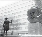  ?? BOND / 360 ?? PETRA EPPERLEIN visits a bust of Karl Marx in his namesake German city, now renamed Chemnitz.