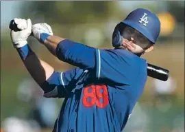  ?? Ralph Freso Getty Images ?? ZACH REKS, 26, is batting.417 with one homer and three doubles this spring. An athletic leap off a scooter at Kentucky helped turn around his baseball fortunes.