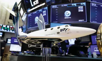  ??  ?? A model of a Virgin Galactic rocket plane on the floor of the New York stock exchange. Photograph: Brendan McDermid/Reuters