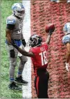  ??  ?? Calvin Ridley signals that the 2- point conversion­was good after catching the pass, giving the Falcons a 22- 16 lead with less than twominutes to play.