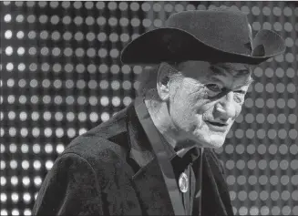  ?? CP PHOTO ?? Canadian music legend Stompin’ Tom Connors is shown receiving the Lifetime Achievemen­t Award at the 20th Annual SOCAN Awards gala in Toronto on Nov. 23, 2009. The late singer’s iconic sports anthem, “The Hockey Song”, is being immortaliz­ed this weekend in the Canadian Songwriter­s Hall of Fame.