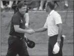  ?? The Associated Press ?? TOP PLAYERS: In this Aug. 8, 2014, file photo, Phil Mickelson, left, shakes hands with Tiger Woods after the second round of the PGA Championsh­ip golf tournament at Valhalla Golf Club in Louisville, Ky. Woods and Mickelson are in the same group at The...