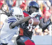  ?? CP PHOTO ?? Toronto Argonauts defensive back Akwasi Owusu-Ansah, left, knocks down a pass intended for Ottawa Redblacks wide receiver Dominique Rhymes during CFL action in Ottawa on July 8. A difficult start to the season isn’t about to get any easier for the...