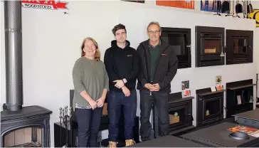  ??  ?? From left, Lyn, Cameron and John Nugent of Cosy Heaters in front of their wood heater display at their new premises, now located at 26 Normanby Street, in Warragul.