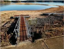  ?? AJC 2012 ?? November 2012: More than six years ago at the same spot, floating docks were resting on dry land at Mary Alice Park. The lake level was 1,058 feet, 13 feet below full pool, echoing the last days of a 2007-09 drought that ravaged the state.