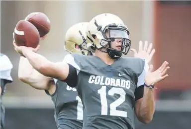  ?? Cliff Grassmick, Daily Camera ?? Buffs quarterbac­k Steven Montez throws during practice on Thursday.