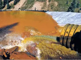  ?? ASSOCIATED PRESS FILE PHOTO ?? Water flows through sediment retention ponds built to reduce heavy metal and chemical contaminan­ts from the Gold King Mine wastewater accident in 2015 outside Silverton, Colo. The EPA is asking a federal court in New Mexico to toss out a lawsuit over a...