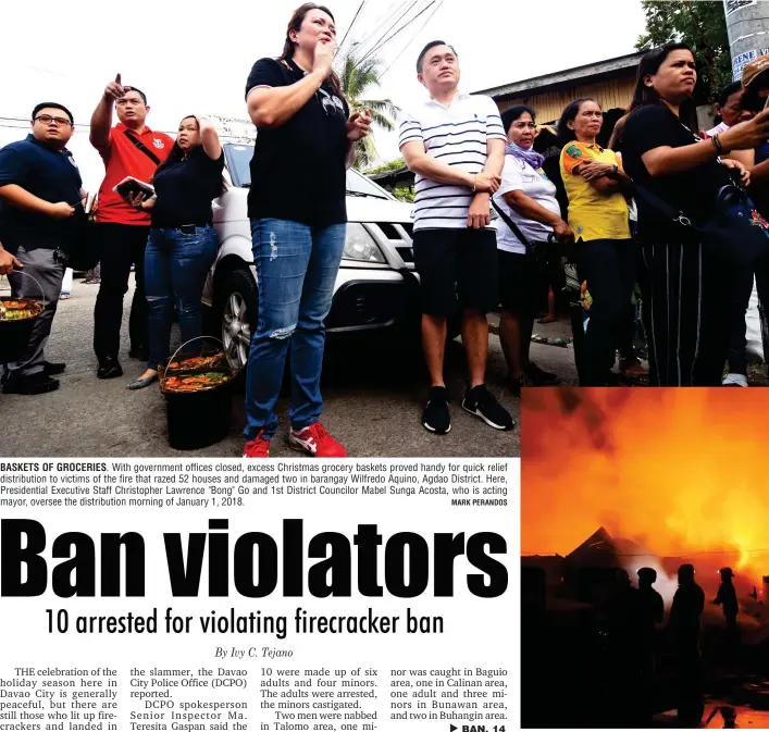  ?? MARK PERANDOS ?? BASKETS OF GROCERIES. With government offices closed, excess Christmas grocery baskets proved handy for quick relief distributi­on to victims of the fire that razed 52 houses and damaged two in barangay Wilfredo Aquino, Agdao District. Here,...