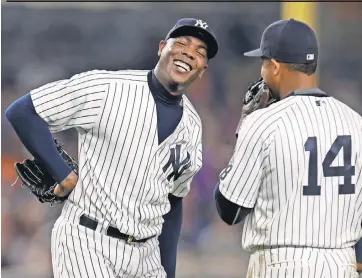  ?? ADAM HUNGER, USA TODAY SPORTS ?? New Cubs closer Aroldis Chapman, left, is a four- time All- Star who has hit 105 mph on the radar gun, making him baseball’s most feared reliever.