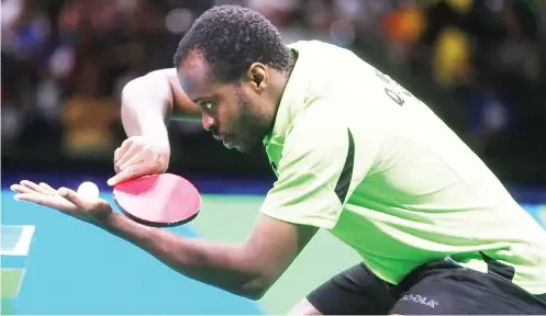  ??  ?? The poster boy of Nigerian table tennis, Aruna Quadri prepraes for a serve