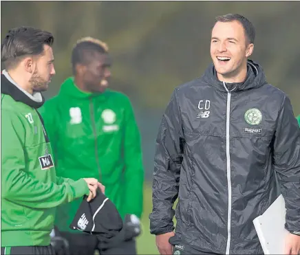  ?? Picture: SNS ?? HAPPY CAMP: Chris Davies, right, has a laugh in training ahead of Celtic’s trip to St Johnstone tomorrow.