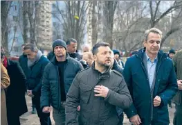  ?? Associated Press ?? UKRAINIAN President Volodymyr Zelensky, left, and Greek Prime Minister Kyriakos Mitsotakis narrowly avoided a Russian missile strike March 6 in Odesa.