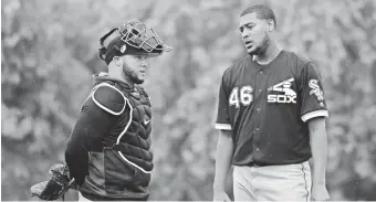  ?? JOE CAMPOREALE/USA TODAY SPORTS ?? Catcher Welington Castillo talks with newly acquired pitcher Ivan Nova. The White Sox hope Nova can stabilize a young rotation.