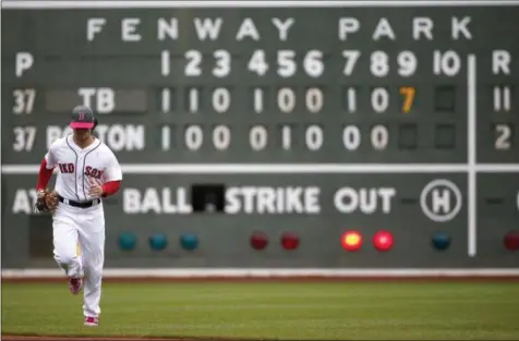  ?? MICHAEL DWYER — THE ASSOCIATED PRESS ?? Boston Red Sox’s Andrew Benintendi comes in from left field during the ninth inning of a baseball game against the Tampa Bay Rays, Sunday in Boston. The Rays won 11-2.