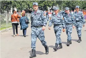  ??  ?? A heavy security presence outside the stadium for the opening ceremony