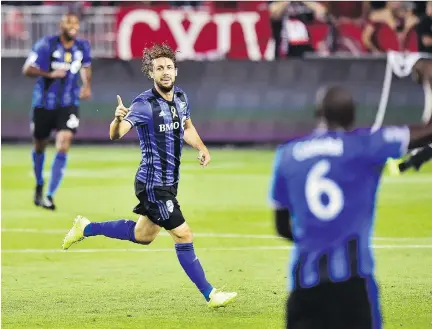  ?? FRANK GUNN/THE CANADIAN PRESS ?? Impact midfielder Marco Donadel celebrates his goal against Toronto FC on Wednesday night.