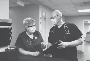  ?? MATT ROBERTS/ THE AMERICAN ACADEMY OF FAMILY PHYSICIANS ?? Drs. Karen and Sterling Ransone at their family practice in Deltaville, Virginia, this summer.