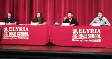  ?? FUAD SHALHOUT — THE MORNING JOURNAL ?? From left, Elyria’s Macy Taylor (softball, Truman), Alison Guerini (volleyball, Mount Union), Brendon Fenton (wrestling, Eastern Michigan) and Devan Nail (baseball, Kent State) smile after signing their national letters of intent on Nov. 8.