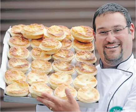  ?? PHOTO: KENT BLECHYNDEN/FAIRFAX NZ ?? Pie guy: An estimated 125 million pies are sold each year – that’s 28 pies per person as shown here by Baking Industry Associatio­n president Michael Gray, owner of Nada Bakery.