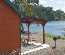  ?? ?? Lake McSwain campground offers a few Park Cabins with lakeside views.