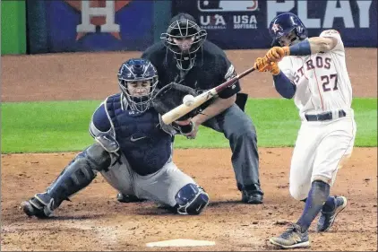  ?? AP PHOTO ?? Houston Astros’ Jose Altuve hits a home run during the fifth inning of Game 7 of baseball’s American League Championsh­ip Series against the New York Yankees on Saturday in Houston.