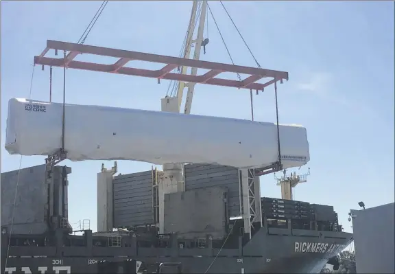  ?? Brian Nearing / Times Union ?? Subway cars made in China are offloaded at the Port of Albany. They are destined for the Massachuse­tts Bay Transit Authority in Boston.