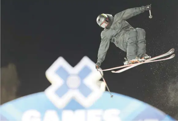  ?? Brent Lewis, The Denver Post ?? Gus Kenworthy catches some air during a practice runWednesd­ay night at Buttermilk­Mountain in preparatio­n for the X Games.